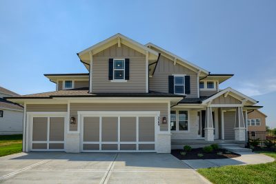 Lancaster - Front Elevation photo of home with lap siding and shutters around the windows