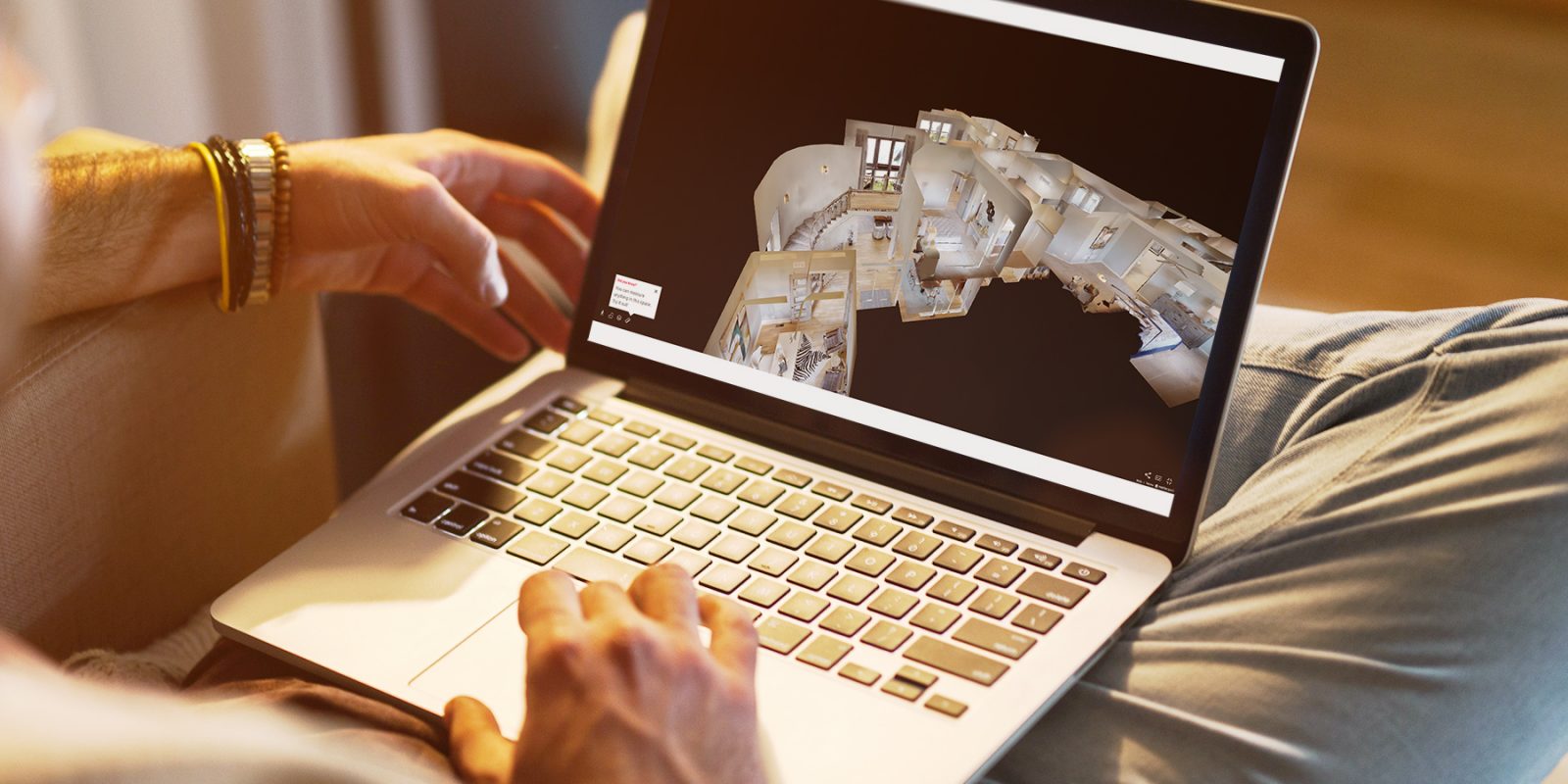 New home search - laptop with floor plan image on screen