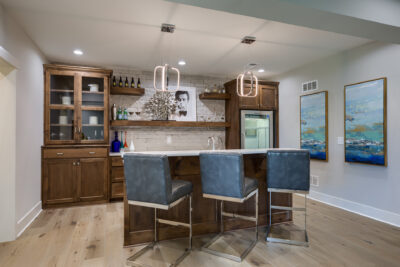 Cheyenne - Lower Level Bar with wood stained cabinets